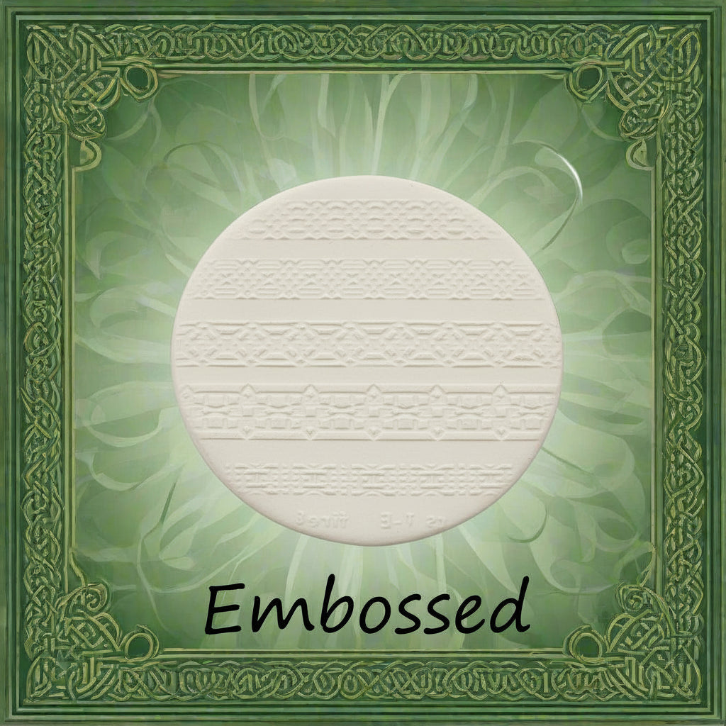 Celtic patterns debossed in clay using an embossed texture mat. 