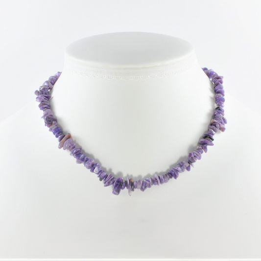 Purple beaded necklace on a white mannequin