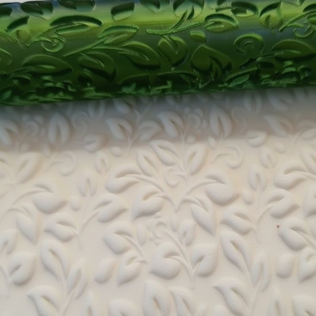 textured clay rolled from green roller and floral patterns.