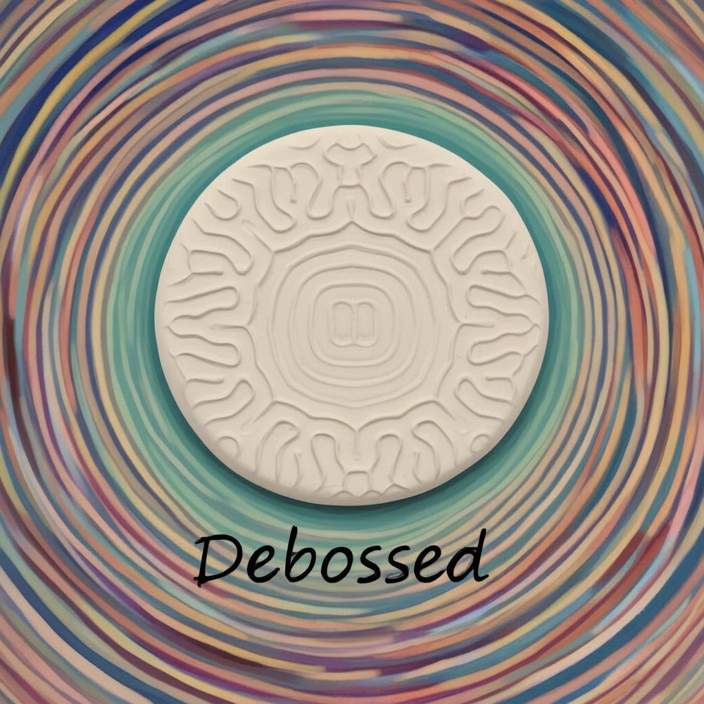 A pattern embossed in clay using a patterned debossed texture mat in grey material. 