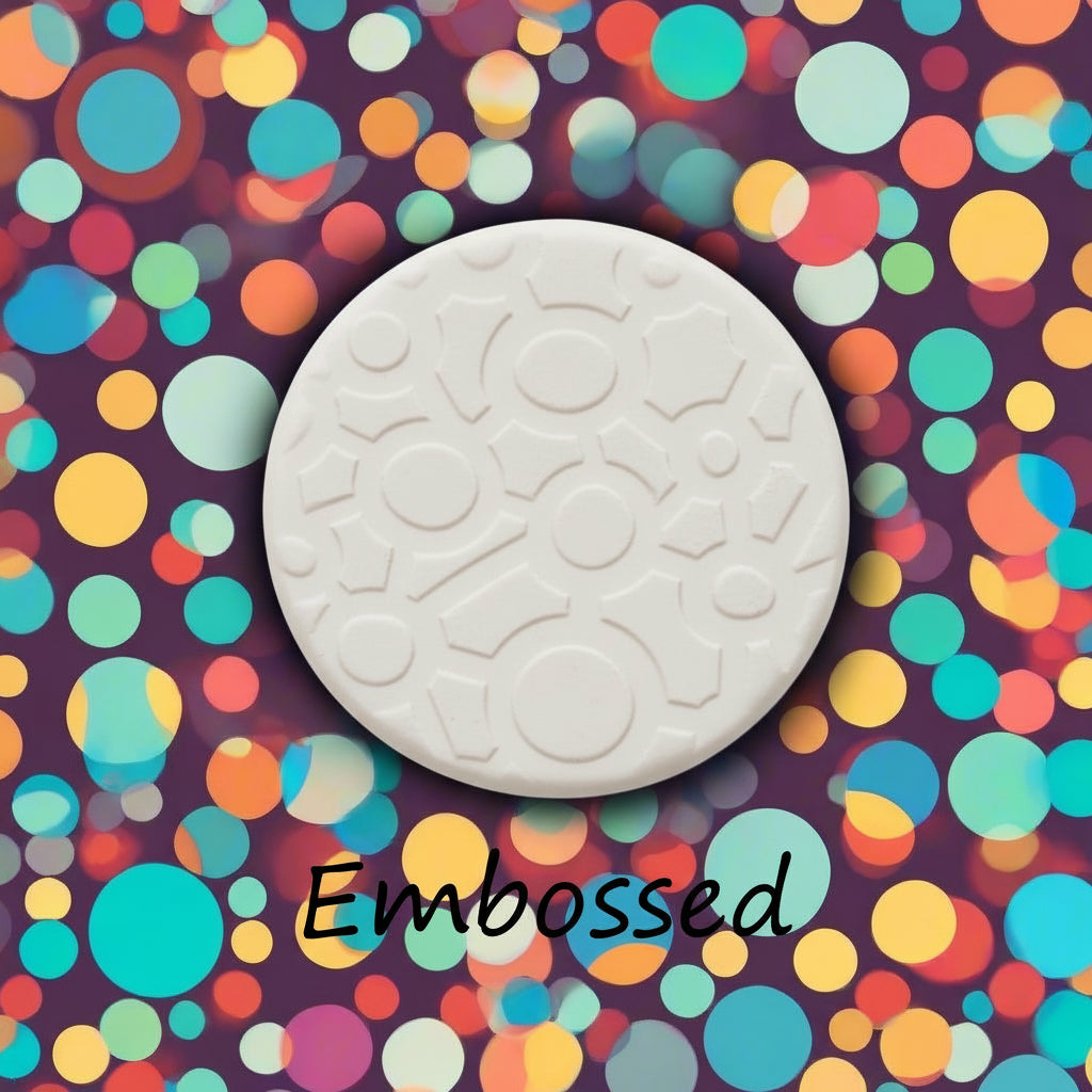 A continuous joined circle pattern  in clay using a patterned embossed texture mat. 