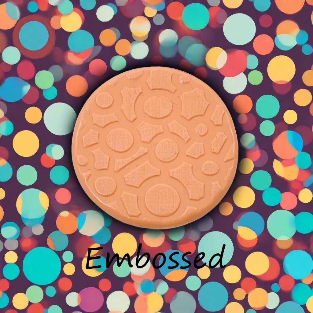 A continuous joined circle pattern  in silly putty Using a patterned embossed texture mat. This will give you an idea of what it will look like on metal clay or polymer clay.