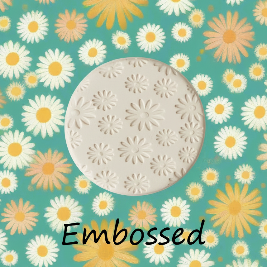 Daisy pattern debossed in clay using a  embossed texture.
