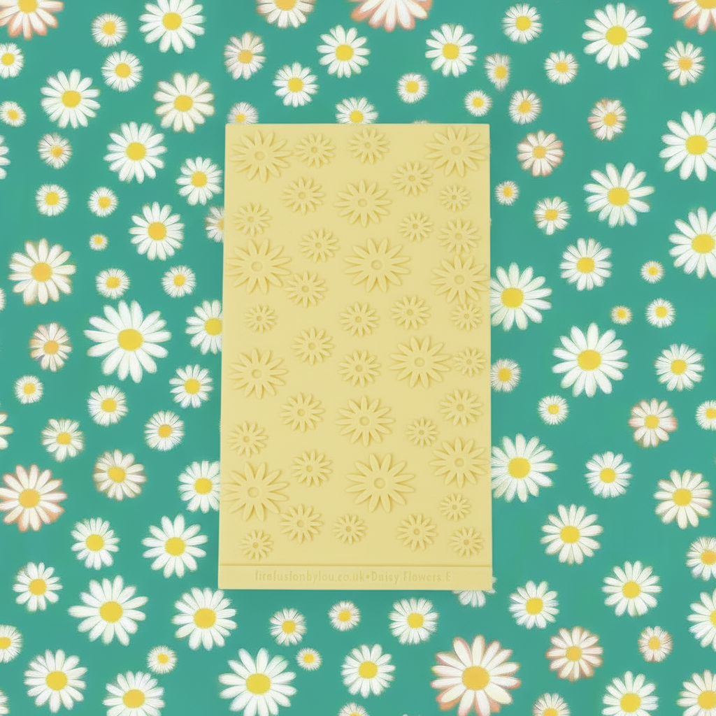 Daisy embossed texture on yellow rubber on a green background with white flowers