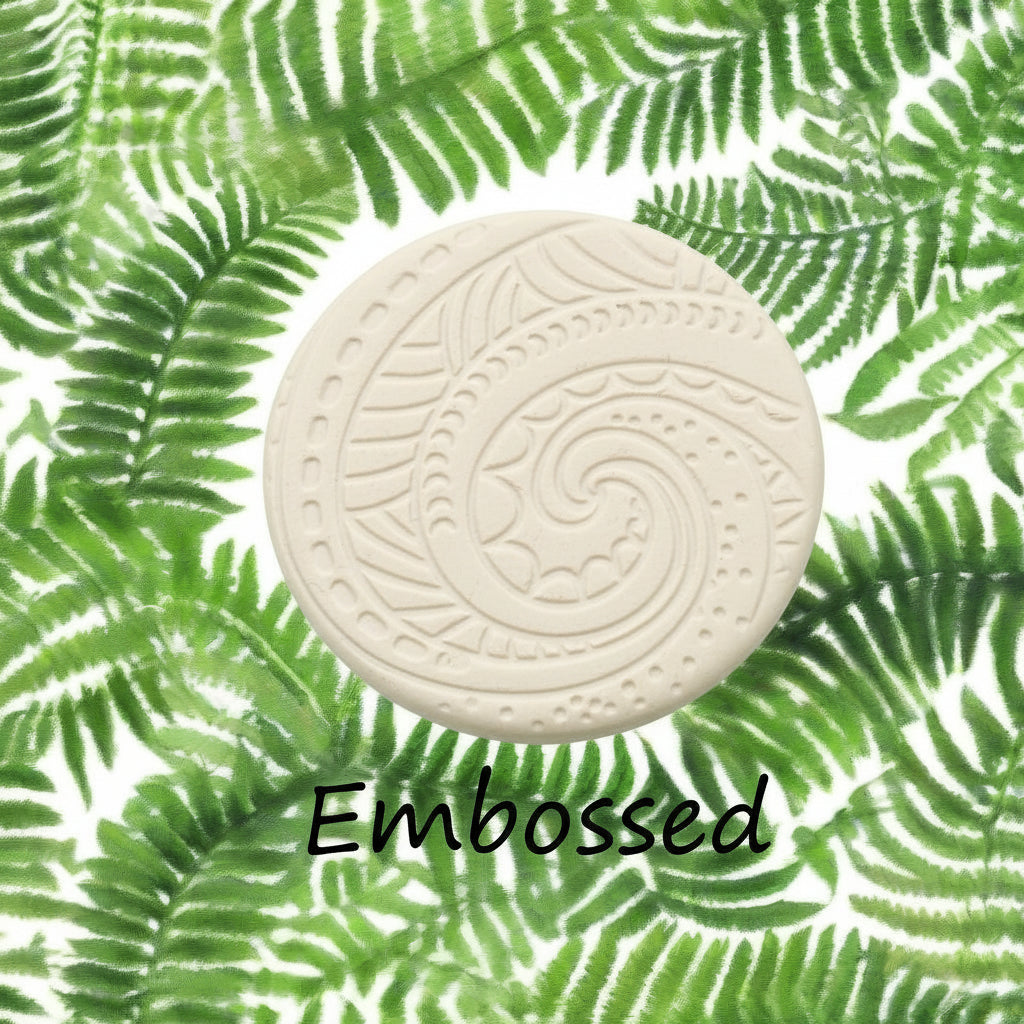 A pattern debossed in clay Using a patterned debossed texture mat. This will give you an idea of what it will look like on metal clay or polymer clay.