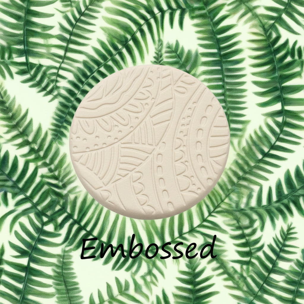 A pattern debossed in clay Using a patterned debossed texture mat. This will give you an idea of what it will look like on metal clay or polymer clay.