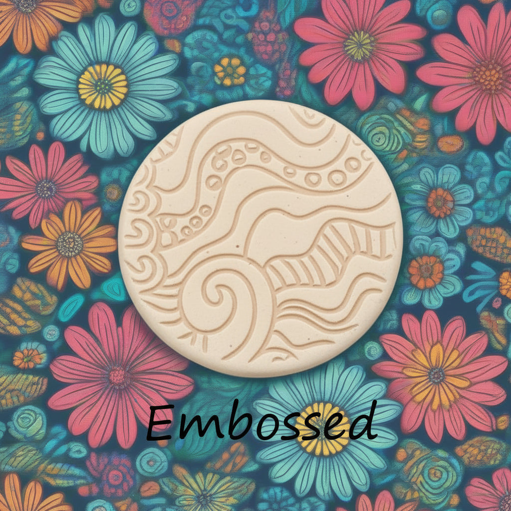 A pattern debossed in clay Using a patterned debossed texture mat. This will give you an idea of what it will look like on metal clay or polymer clay.