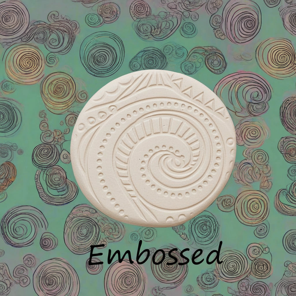 A pattern debossed in clay using a patterned embossed texture mat.