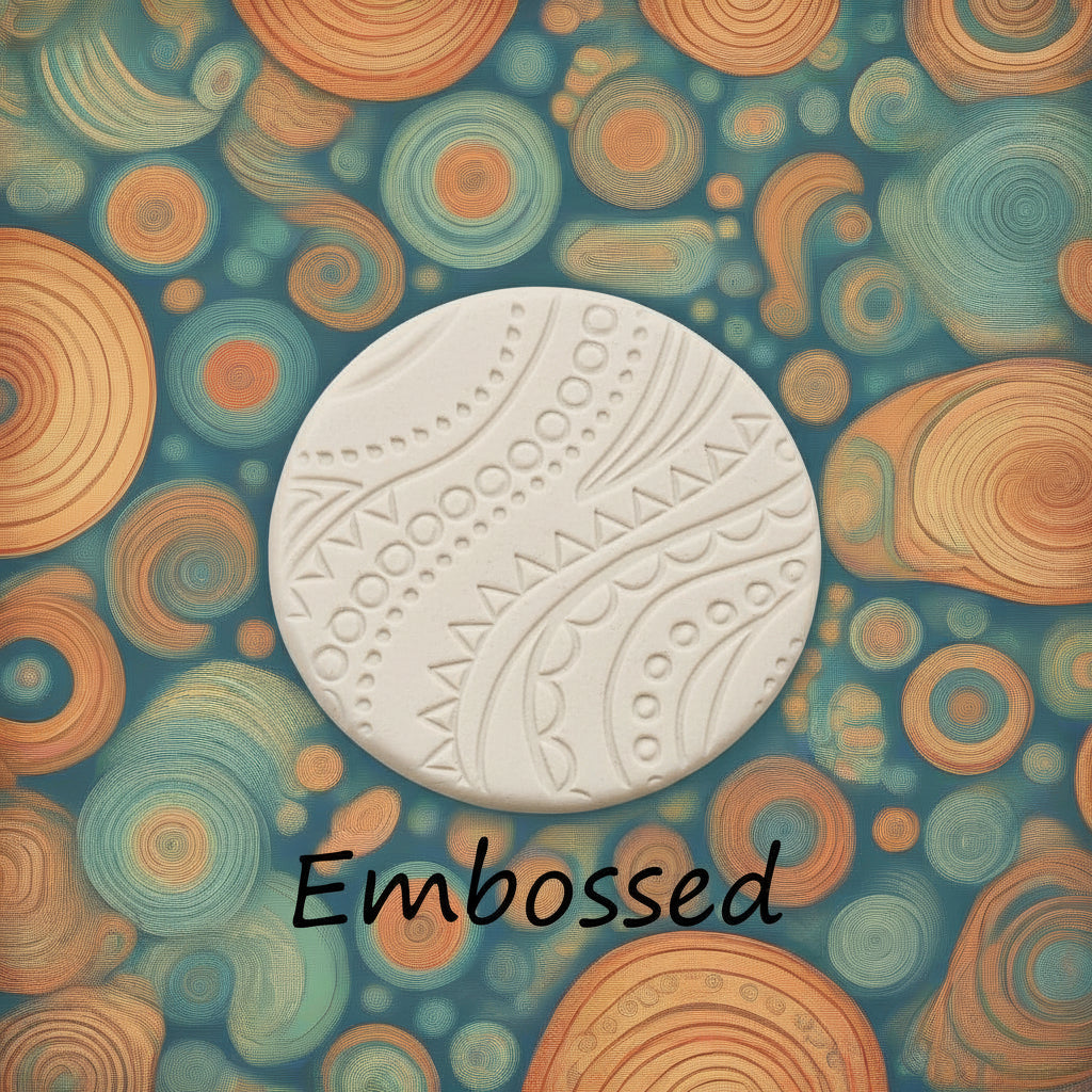 A pattern debossed in clay using a patterned embossed texture mat.