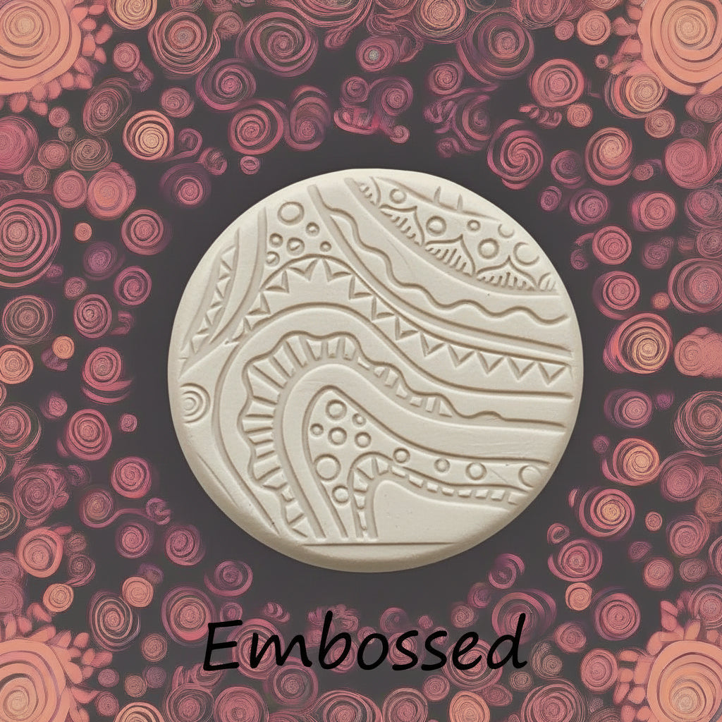 A pattern debossed in clay using a patterned embossed texture mat.