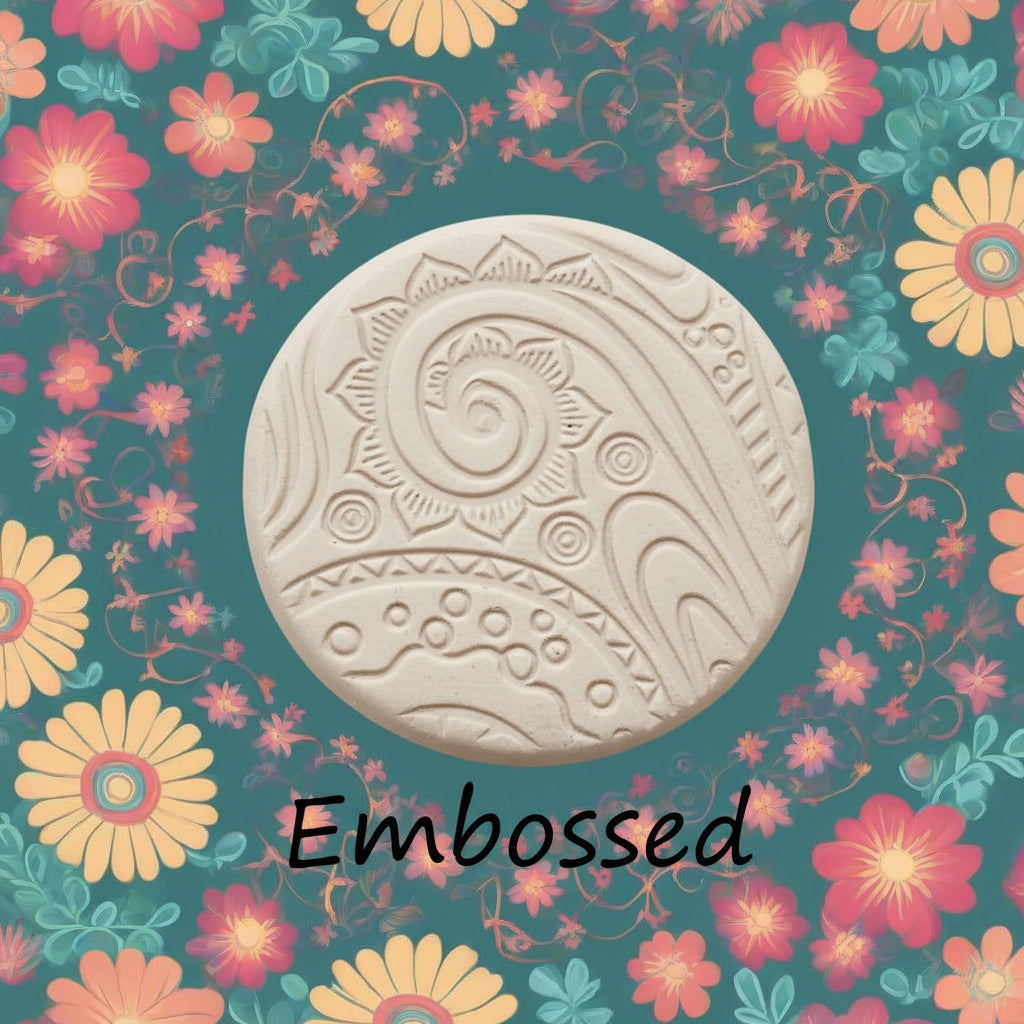A pattern debossed in clay using a patterned embossed texture mat. 