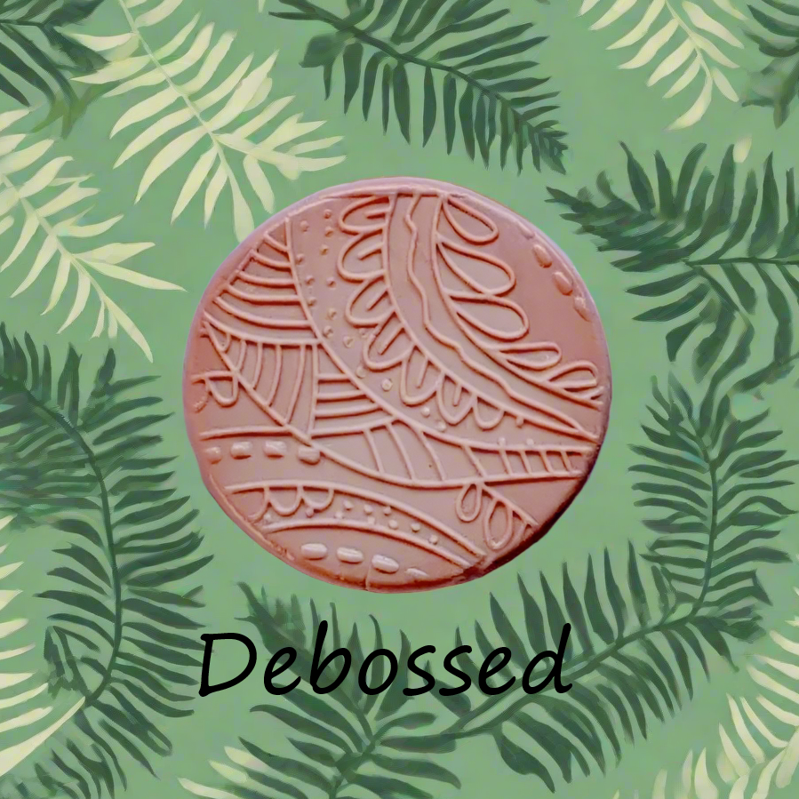 A pattern embossed in silly putty Using a patterned debossed texture mat in grey material. This will give you an idea of what it will look like on metal clay or polymer clay.