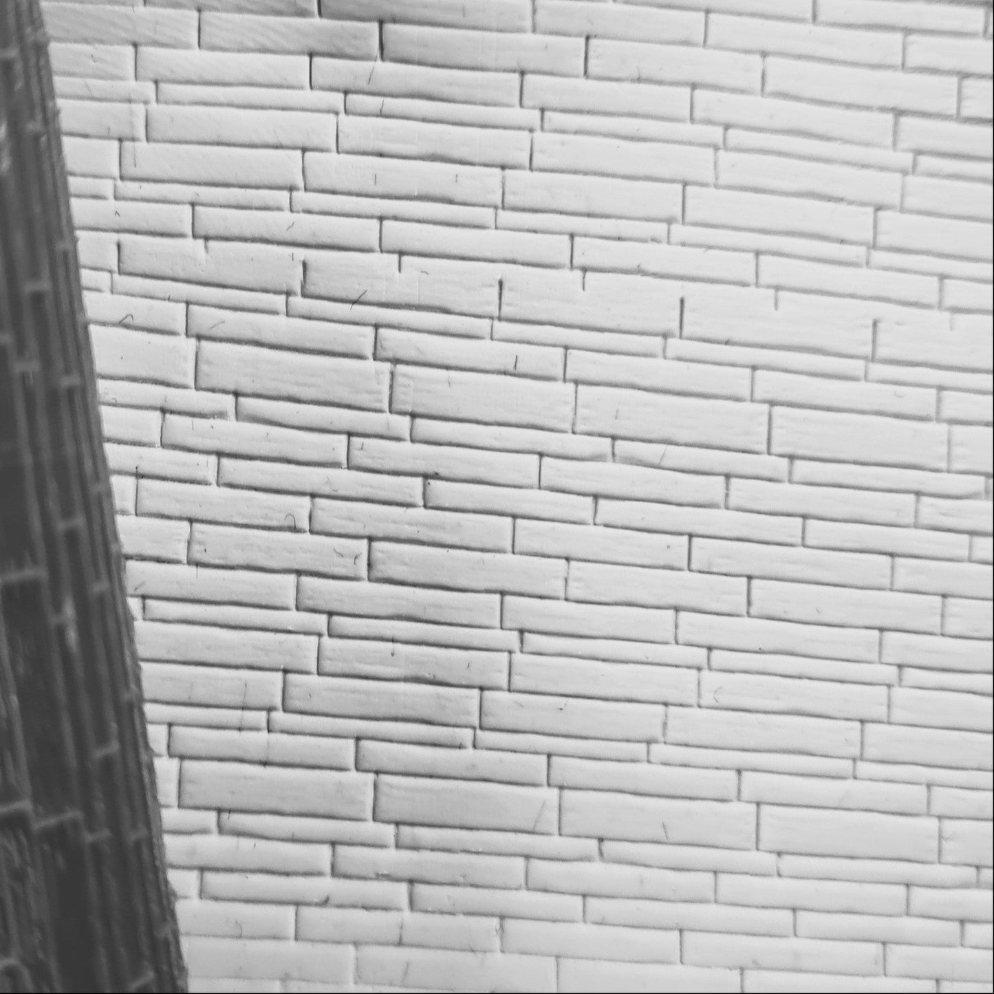 Close-up of a textured white brick texture