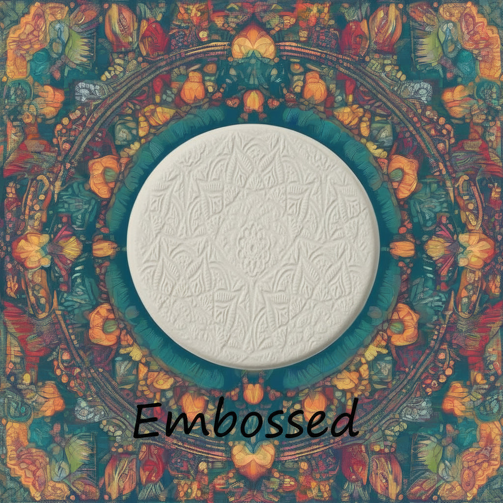 A lacey flowery mandala pattern debossed in clay Using a embossed texture mat.