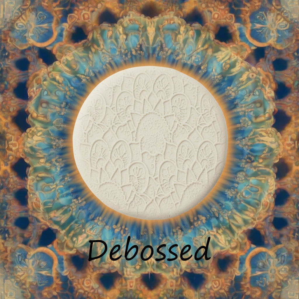 A flowery mandala pattern embossed in clay sing a debossed texture mat. 