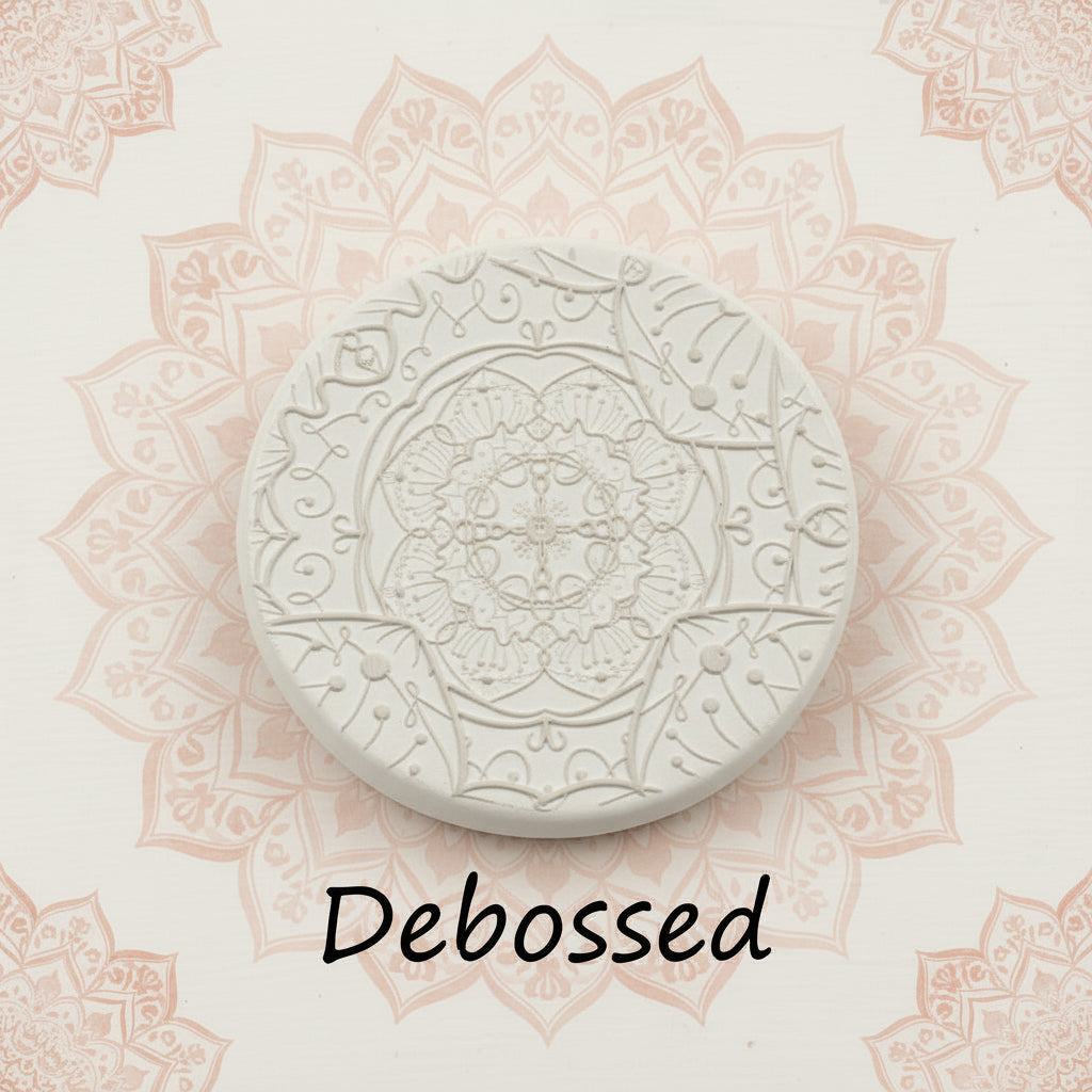 A flowery mandala pattern embossed in clay using a debossed texture mat.
