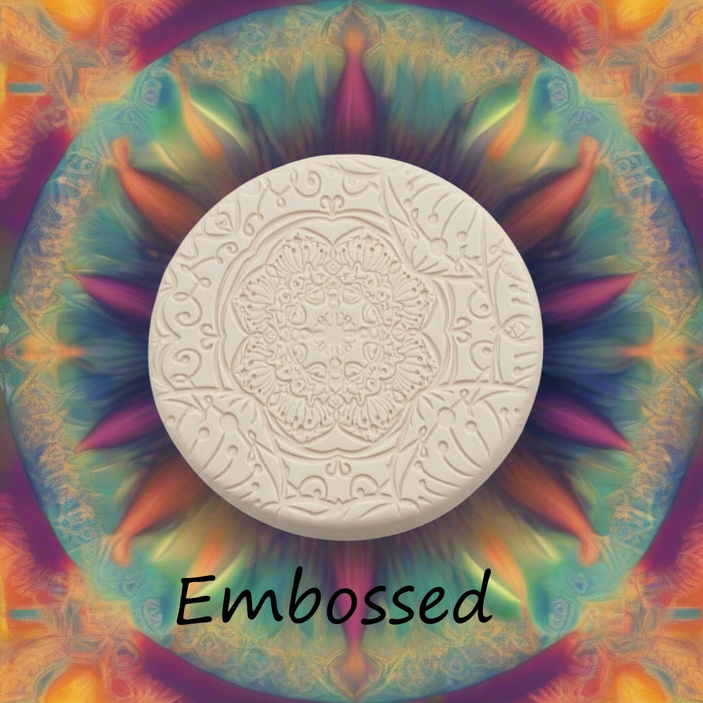 A flowery mandala pattern debossed in silly putty Using a embossed texture mat in grey material. 
