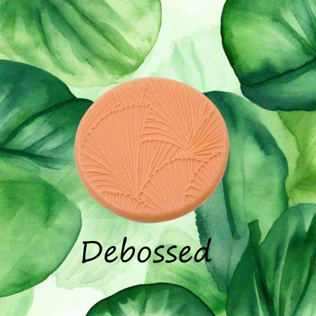 fan leaves embossed in silly putty Using a  debossed texture mat. This will give you an idea of what it will look like on metal clay or polymer clay