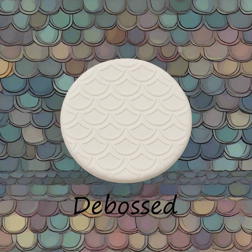 A pattern embossed in clay using a patterned debossed texture mat.