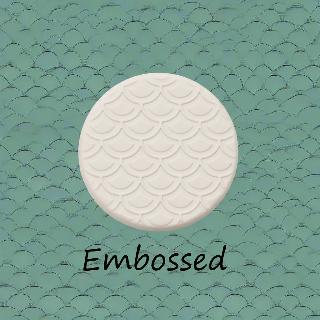 A pattern debossed and embossed in clay using a patterned embossed texture mat. 