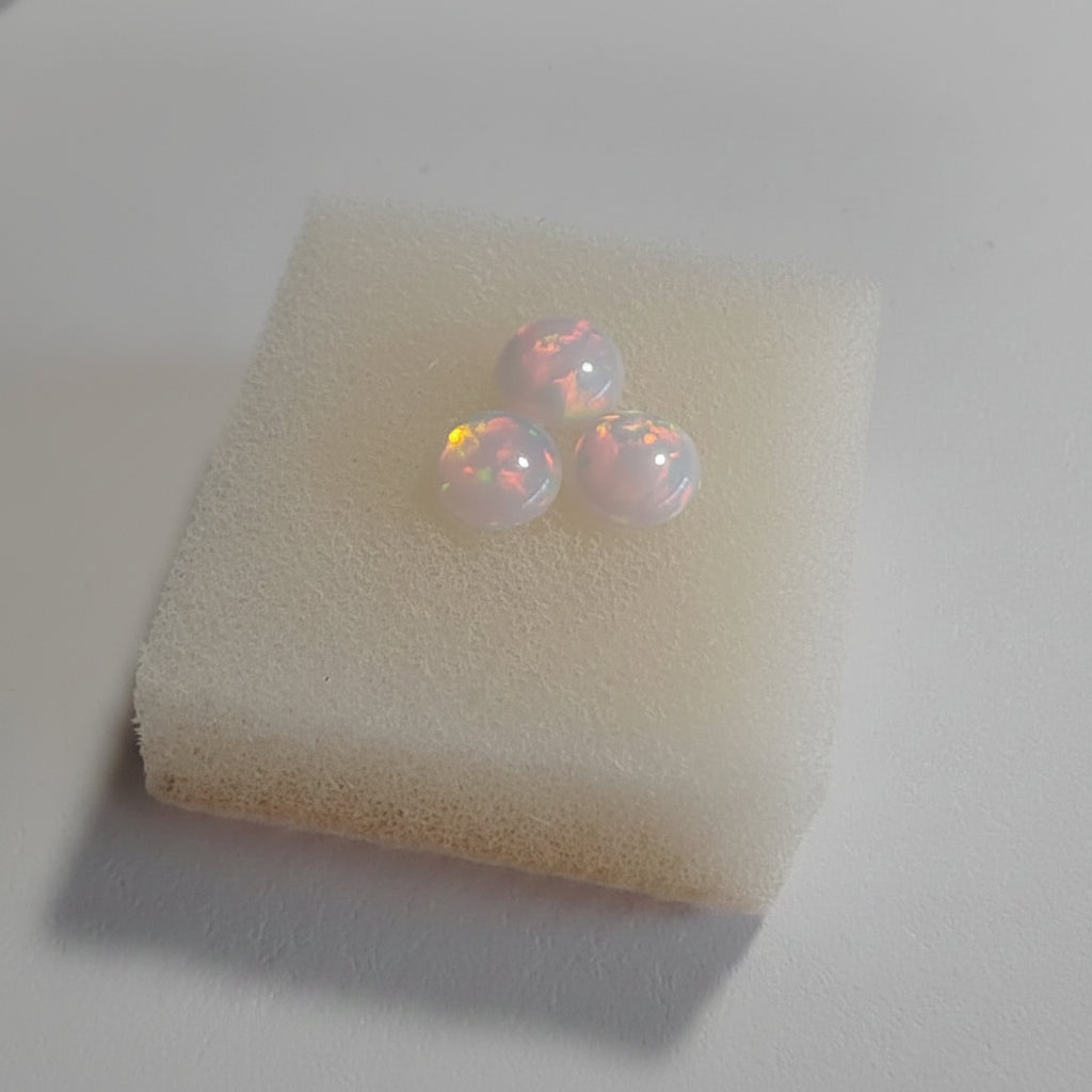 Fireable pink with red flash Opal on a soft white background