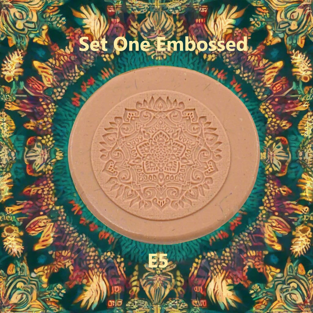 A mandala pattern debossed in silly putty using an embossed texture mat. This will give you an idea of what it will look like on metal clay or polymer clay.