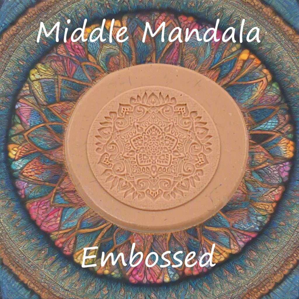 A mandala pattern debossed in silly putty using an embossed texture mat. This will give you an idea of what it will look like on metal clay or polymer clay.