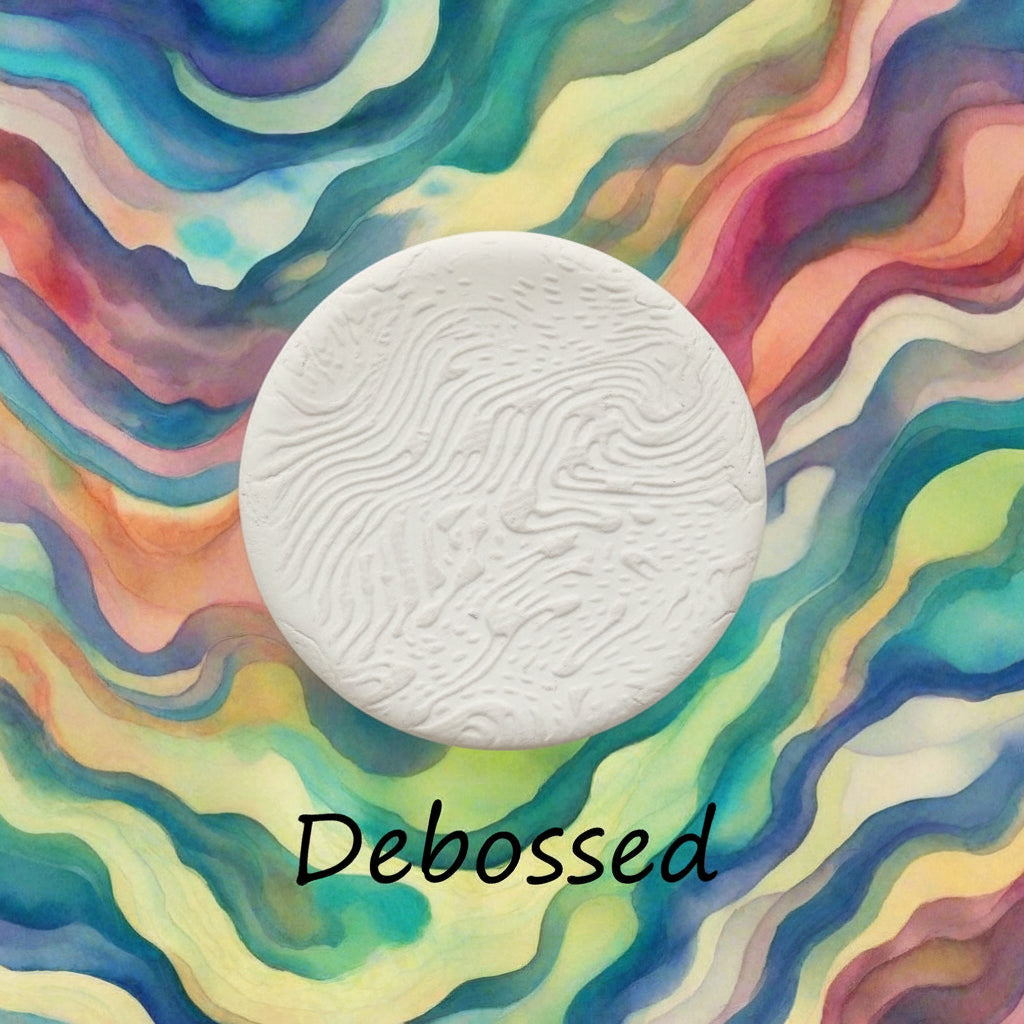 A pattern embossed in clay using a patterned debossed texture mat.