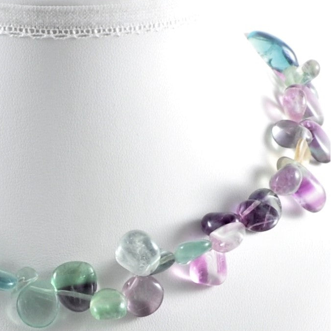 Necklace with multicolored beads on a white background