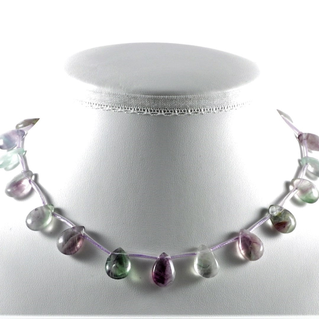 Necklace with multicolored beads on a white mannequin neck