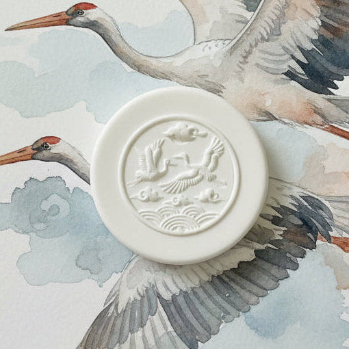 White clay stamped with bird design on a bird background.