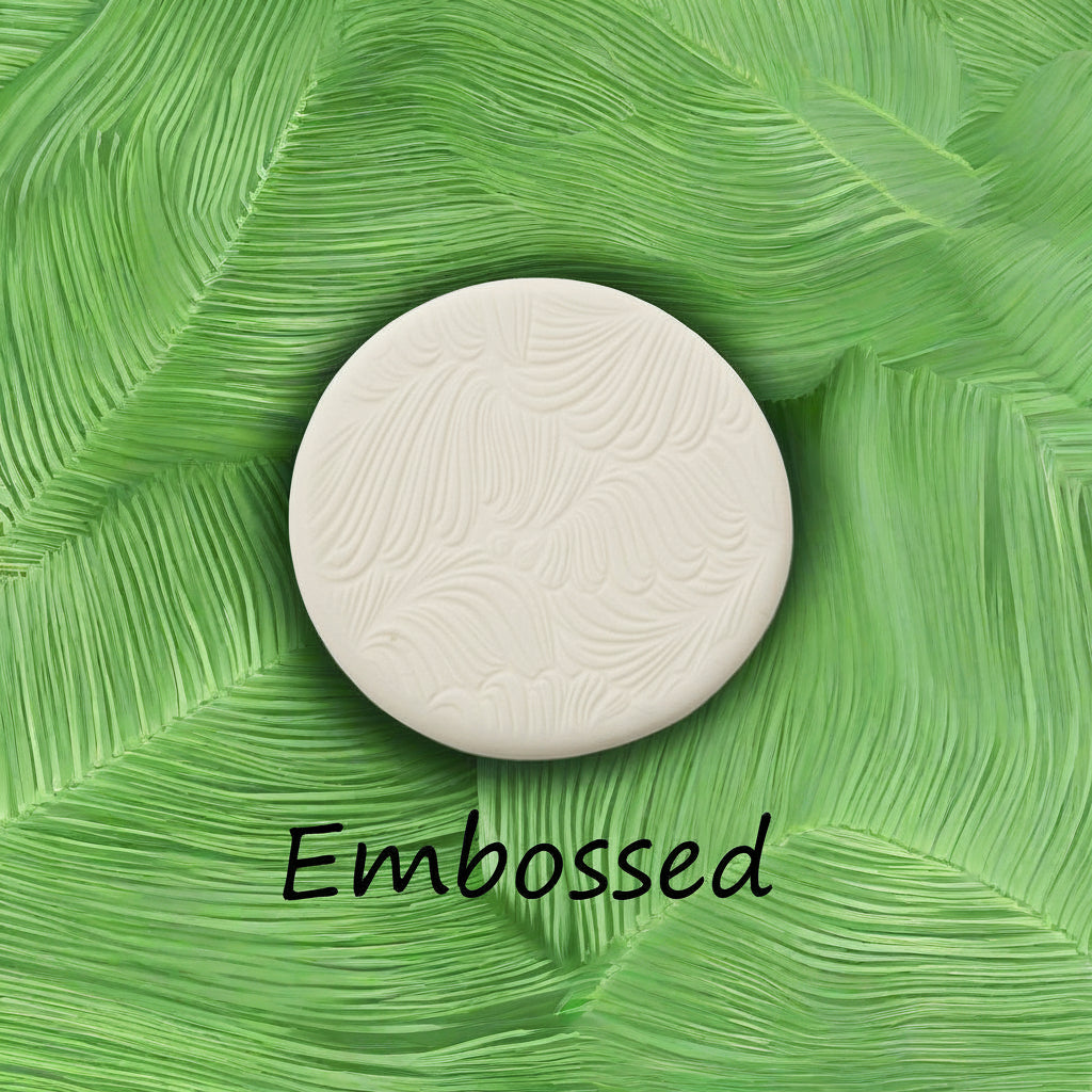 frond leaves debossed in clay Using a  embossed texture mat. This will give you an idea of what it will look like on metal clay or polymer clay