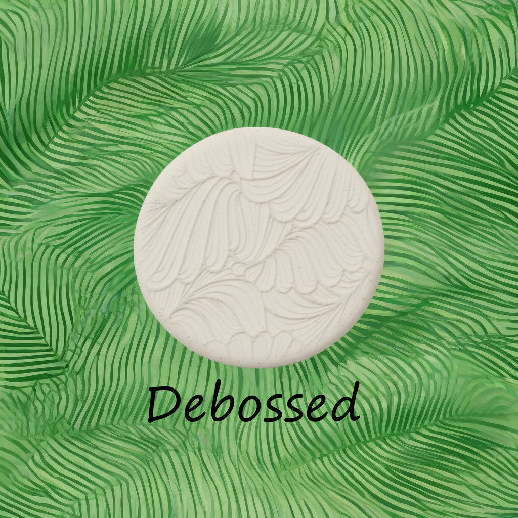 frond leaves embossed in clay Using a  debossed texture mat. This will give you an idea of what it will look like on metal clay or polymer clay