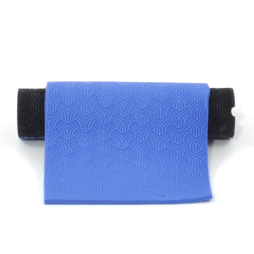 Geometric pattern In Blue polymer clay on a white background