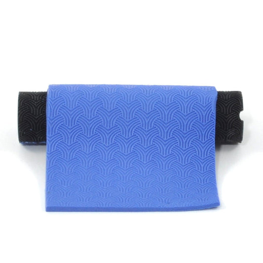 Geometric pattern In Blue polymer clay on a white background