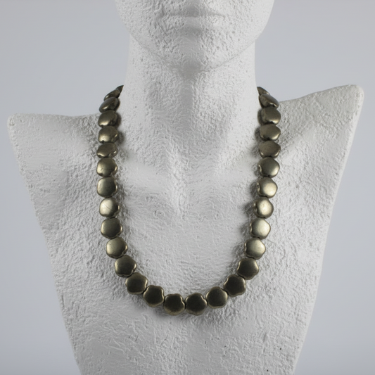 "Hematite electroplated gold flower beads 11mm displayed on jewellery bust showing elegant necklace drape"