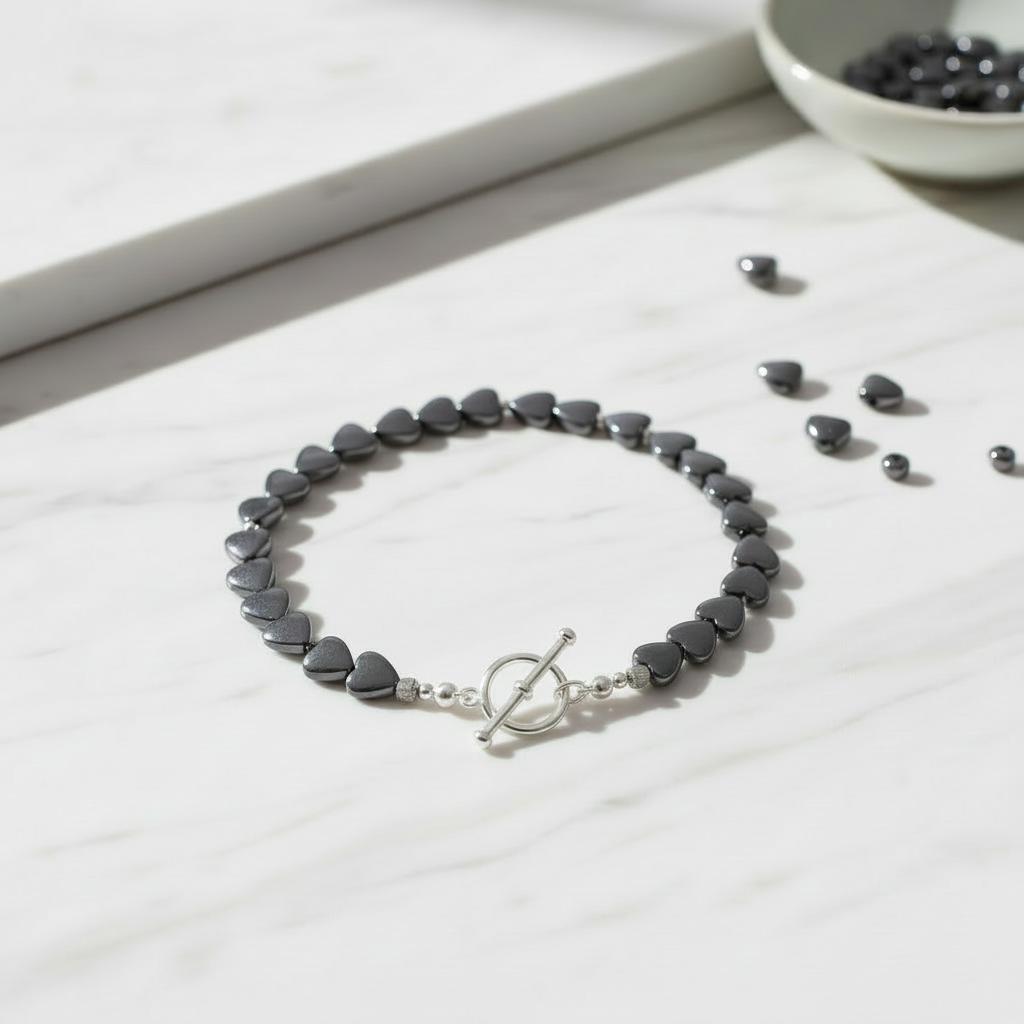 Handmade bracelet created with hematite heart beads 9x8mm showing finished jewellery design example with metallic grey hearts"