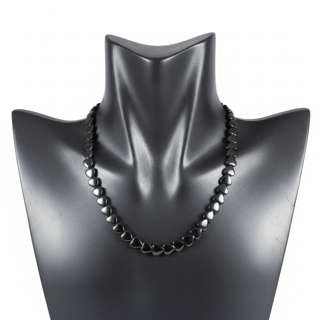 "Hematite heart beads 9x8mm strand displayed showing flat heart shaped metallic grey gemstone beads"
