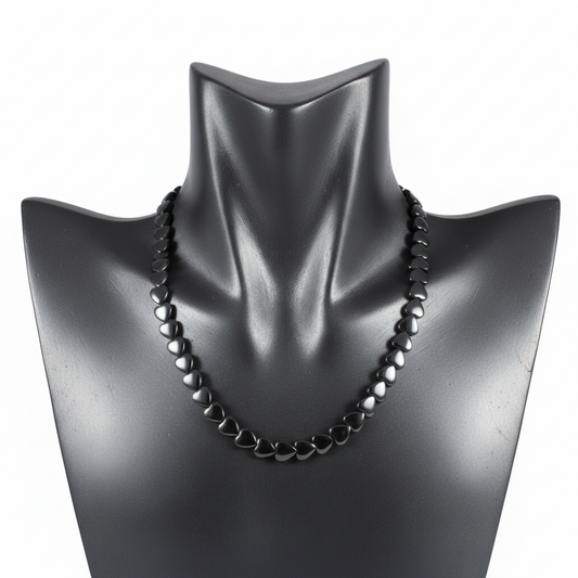 "Hematite heart beads 9x8mm strand displayed showing flat heart shaped metallic grey gemstone beads"