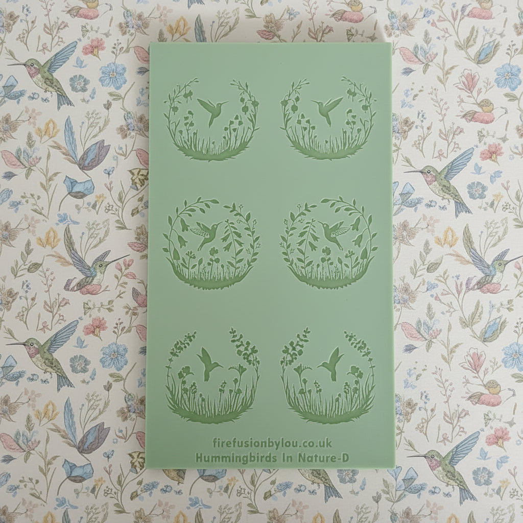 A texture mat with six circular cavities, each featuring an embossed design of a bird in a floral wreath. The brand name firefusionbylou.
