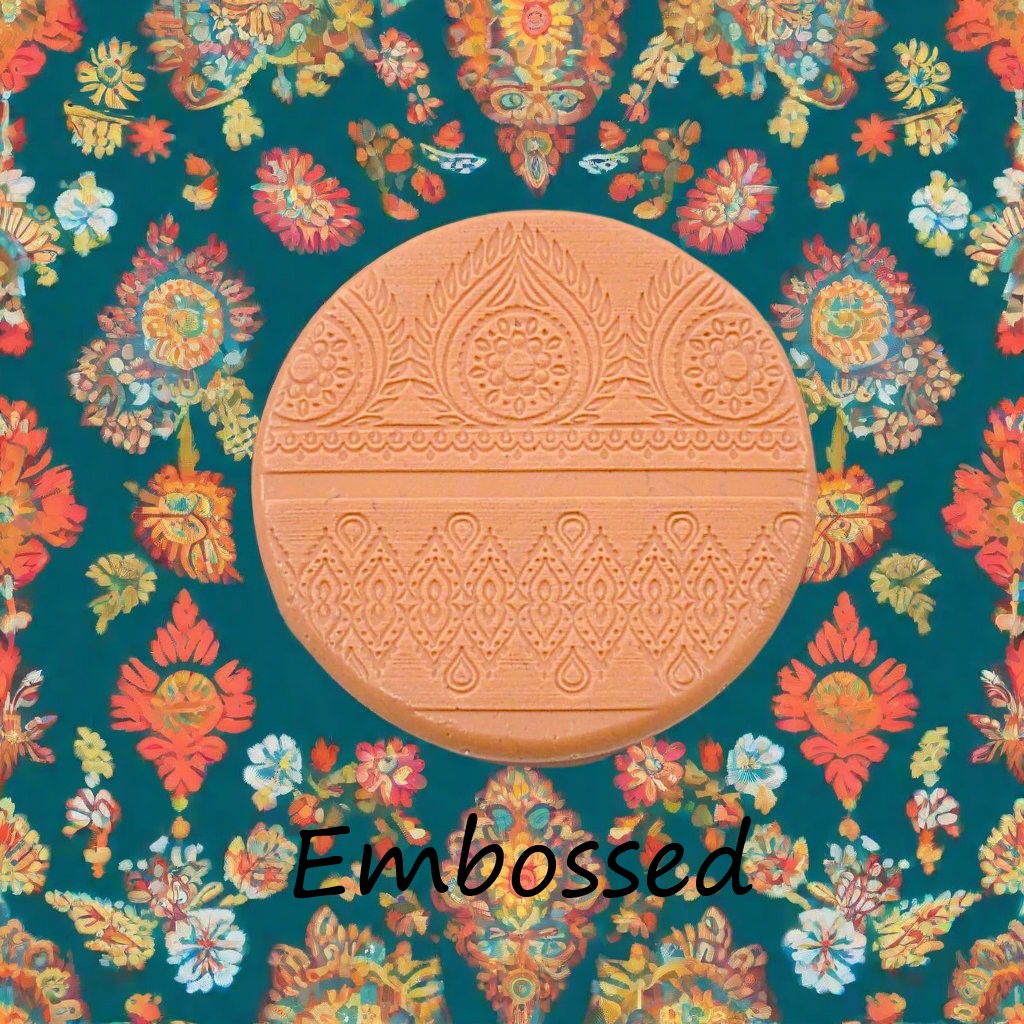 A pattern debossed in silly putty Using an Indian henna embossed texture mat in grey material. This will give you an idea of what it will look like on metal clay or polymer clay.