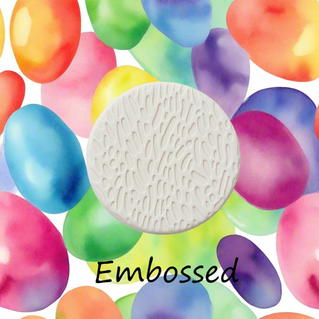 A Jelly bean pattern debossed in clay using a patterned embossed texture mat.