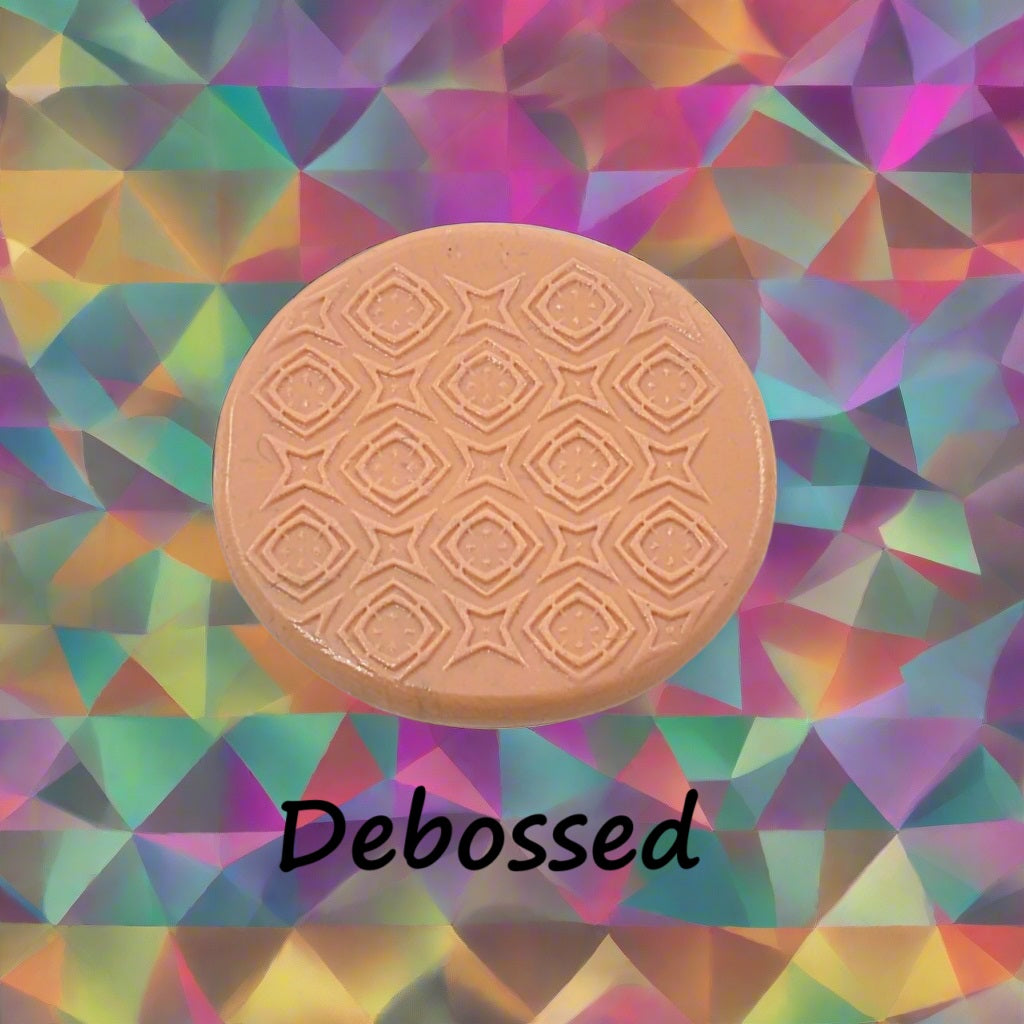 A pattern embossed in silly putty Using a patterned debossed texture mat in grey material. This will give you an idea of what it will look like on metal clay or polymer clay.