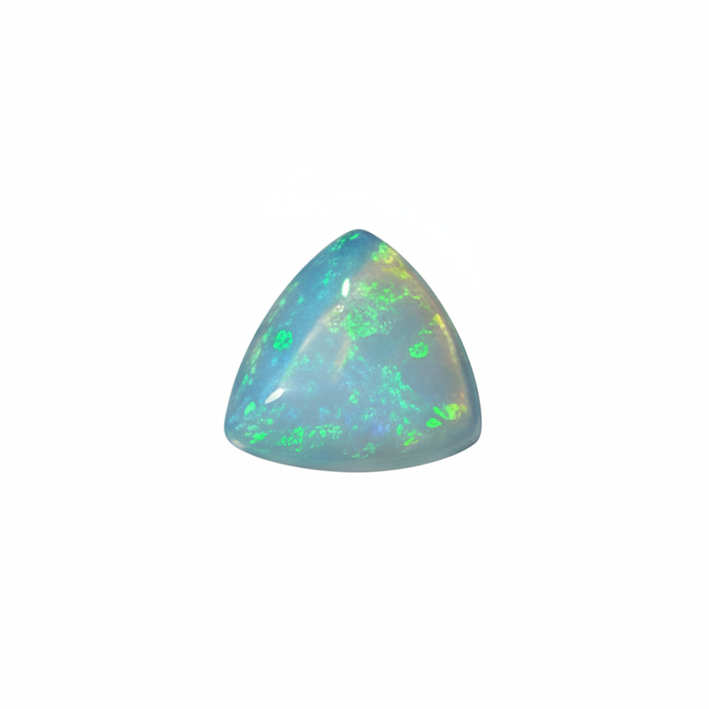 A small trillion opal gemstone with a light blue-grey base and iridescent flashes of green, blue, and white, cantered on a plain light grey background.