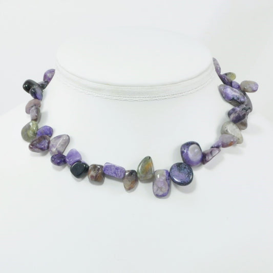 Necklace with multicolored stones on a white background
