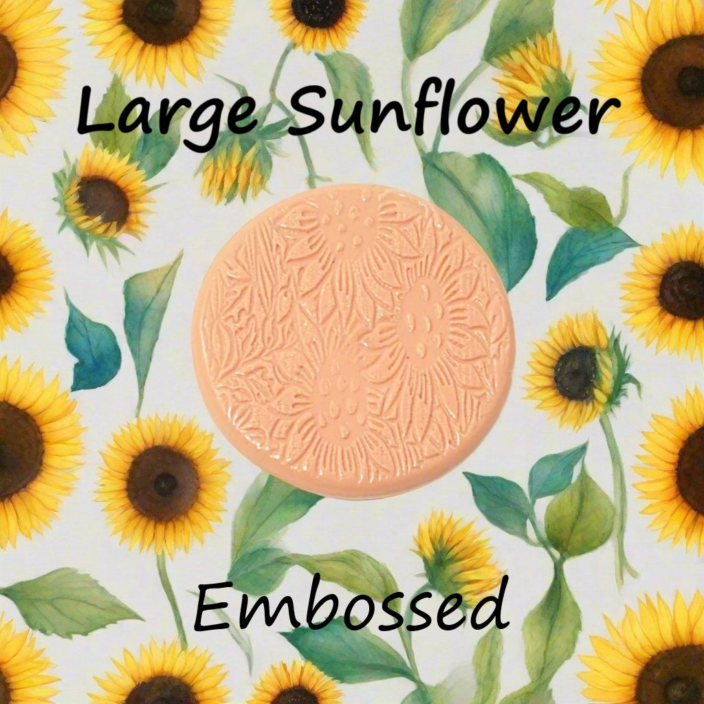 Large sunflower pattern embossed and debossed in silly putty Using a embossed and debossed texture mat. This will give you an idea of what it will look like on metal clay or polymer clay.