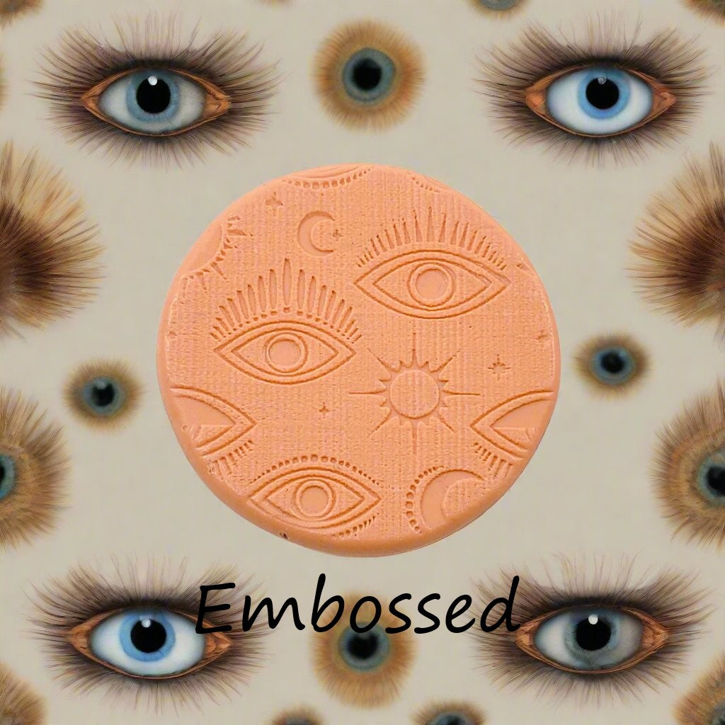 A mystical eye pattern debossed in silly putty Using a patterned embossed texture mat in grey material. This will give you an idea of what it will look like on metal clay or polymer clay.