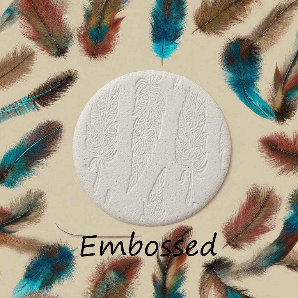An intricate tribal feather pattern debossed in clay using a patterned debossed texture mat.