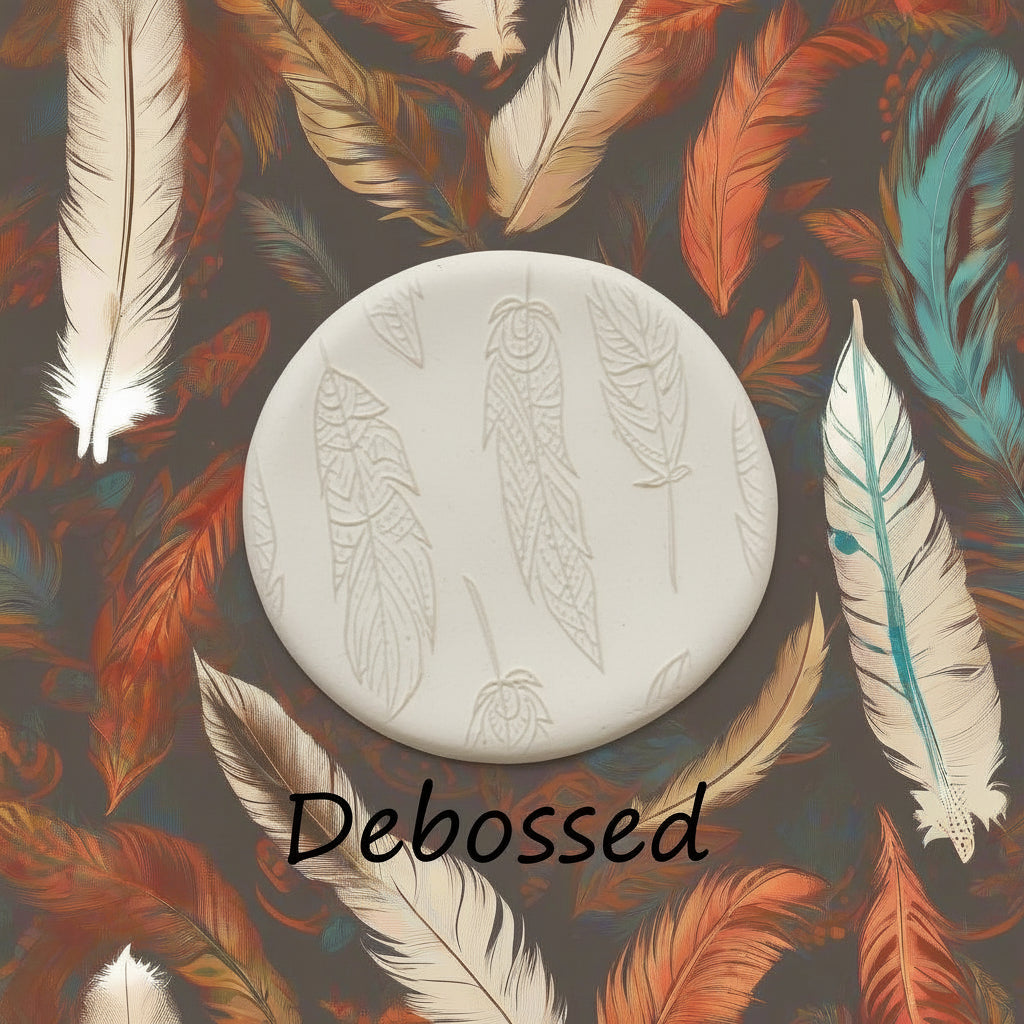 An intricate tribal feather pattern embossed in clay using a patterned debossed texture mat. 