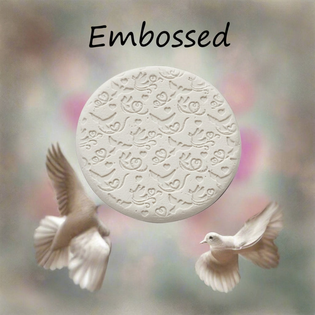 A pattern debossed in clay using a patterned embossed texture mat.